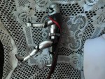 silver action figure side b